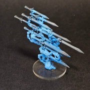 A Used Warhammer Age of Sigmar: Quicksilver Swords Endless Spell miniature with five silver swords and blue ethereal forms.