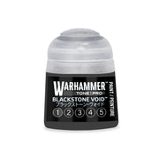 A small pot of Warhammer Tone Pro hobby paint in Blackstone Void, featuring a translucent cap and a label with a row of circled numbers one through five.
