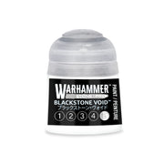 A Warhammer Tone Pro plastic paint pot with a black Blackstone Void label, featuring a numbered scale from one to five with the fifth number highlighted.
