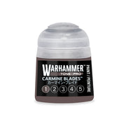 A small Warhammer Tone Pro plastic pot of Carmine Blades brown paint, featuring a translucent cap and a label with a numbered scale from one to five.