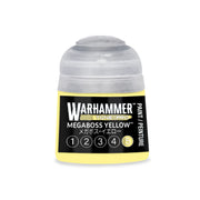 A small Warhammer Tone Pro paint pot featuring a label with the text Megaboss Yellow and a numbered scale from one to five, with the number five highlighted.