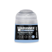 A Warhammer Tone Pro paint pot containing light blue paint, with a label marked Ultramar Blue and a row of numbers one through five, with the number five circled.