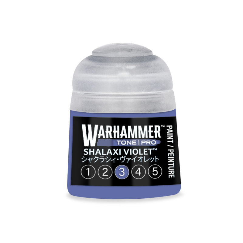 A small plastic Warhammer Tone Pro paint pot with a grey cap containing violet paint, labeled Shalaxi Violet with a numbered scale from 1 to 5.