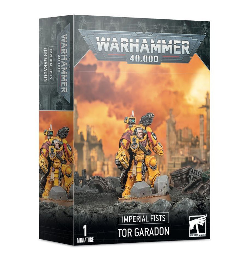 Warhammer 40k: Imperial Fists - Tor Garadon features the Captain Tor Garadon miniature in iconic yellow armor, posed in a battle-scarred, industrial setting. The set includes a Citadel 40mm Round Base from Games Workshop.