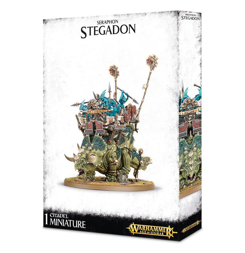 Warhammer Age of Sigmar: Seraphon - Stegadon miniature kit by Games Workshop. Box shows dinosaur-like creature with lizard warriors and weapons atop a Citadel base, plus logo and branding.