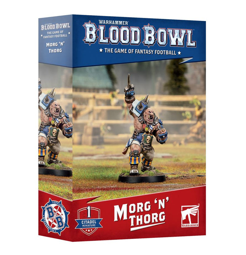 Box for Blood Bowl: Morg ‘n’ Throg featuring a painted miniature of Morg N Thorg, an ogre in blue and yellow armor raising a fist on a football field. The red and blue box displays game and brand logos, and highlights the included Citadel 40mm Round Base from Games Workshop for easy miniature assembly.