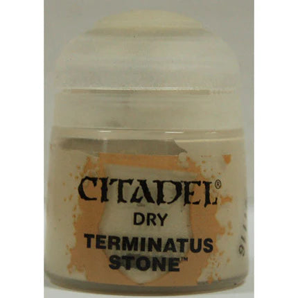 A small Citadel Dry Paints: Terminatus Stone (12ml) pot with light beige paint inside, Citadel logo and orange splatters visible.