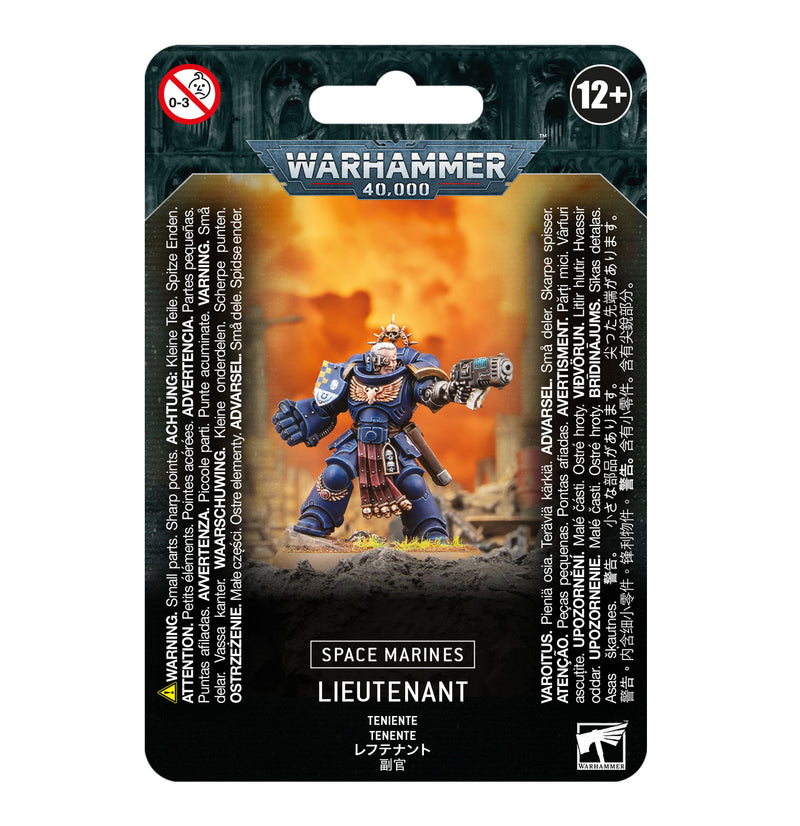 The Warhammer 40k: Space Marines - Lieutenant miniature features detailed armor, rocky terrain with flames, a Citadel 40mm Round Base, and packaging displaying age 12+ warning and product info in various languages.