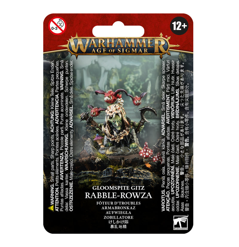 The Warhammer Age of Sigmar: Gloomspite Gitz: Rabble-Rowza pack includes an unpainted goblin miniature with mushrooms on a Citadel 32mm base, with packaging displaying multilingual warnings and age restrictions.
