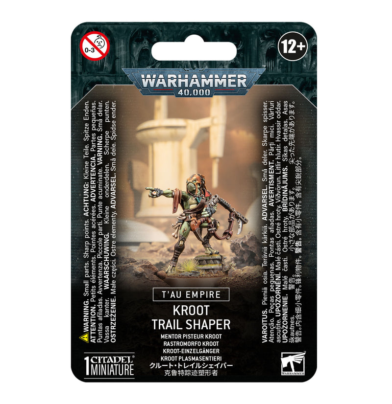 The image shows a Warhammer 40k: Tau Empire - Kroot Trail Shaper miniature on a 32mm base, with packaging and age 12+ warning.