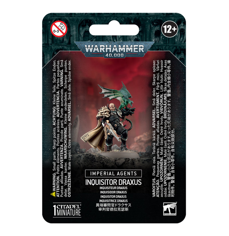 Packaging for Warhammer 40k: Imperial Agents - Inquisitor Draxus showing painted miniature, instructions, base, warnings, age 12+.