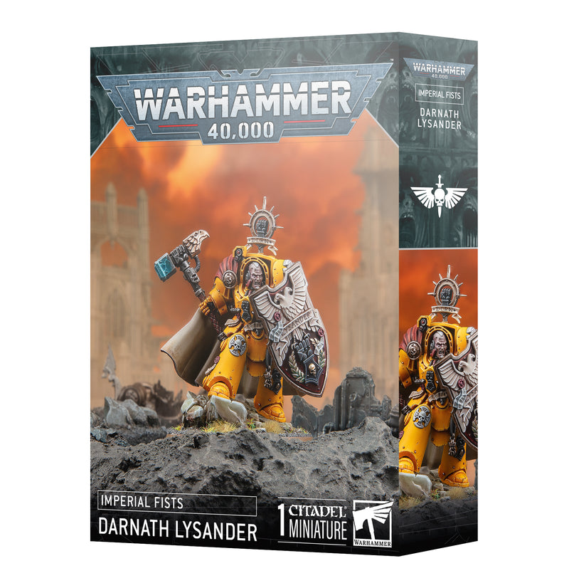 The Warhammer 40k: Imperial Fists Darnath Lysander box shows the yellow-armored hero, hammer and shield, on a fiery battlefield.