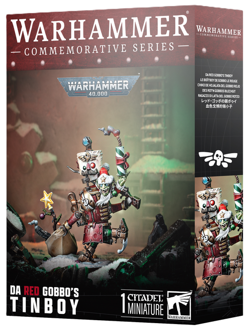 Box cover of Warhammer 40k: Orks - Da Red Gobbo's Tin Boy from Games Workshop, featuring an unpainted miniature of a festive goblin robot with gifts and decorations in a holiday-themed setting.