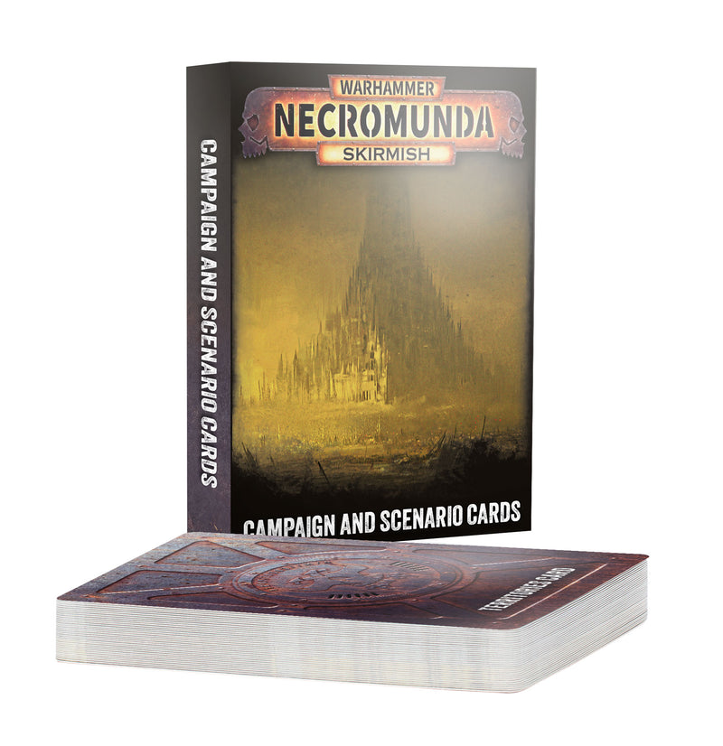 A box labeled Necromunda: Campaign and Scenario Cards stands behind a deck of ornate campaign and scenario cards, their backs richly designed. The box features a dark, ominous citadel illustration, characteristic of Games Workshop’s atmospheric style.