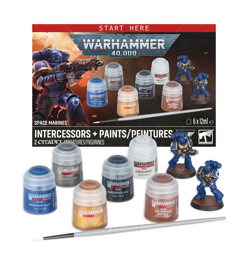 Warhammer 40k: Space Marines: Intercessors + Paints set featuring paint pots, a paintbrush, two detailed Space Marines Intercessors miniatures, and the product packaging in the background.