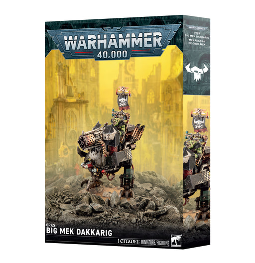 Warhammer 40k: Orks - Big Mek Dakkarig miniature box. The box art depicts a weapon-laden mechanical ork standing amid ruined city scenery, with the Warhammer 40,000 logo displayed at the top.