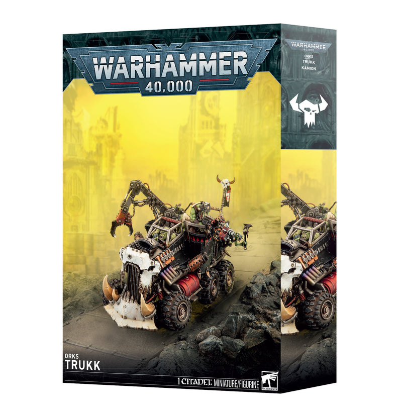Warhammer 40k: Orks - Trukk by Games Workshop, a model kit featuring a detailed Ork vehicle with themed decorations, set against a yellow, ruined city backdrop.