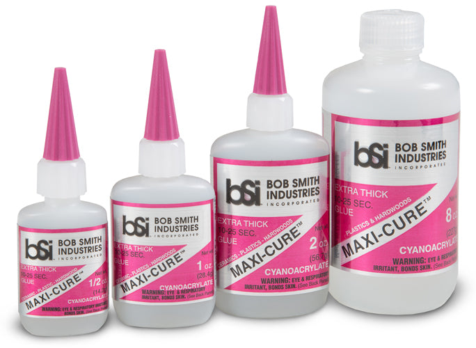 Set of Bob Smith Industries Maxi-Cure cyanoacrylate glue bottles with pink caps on a white background.
