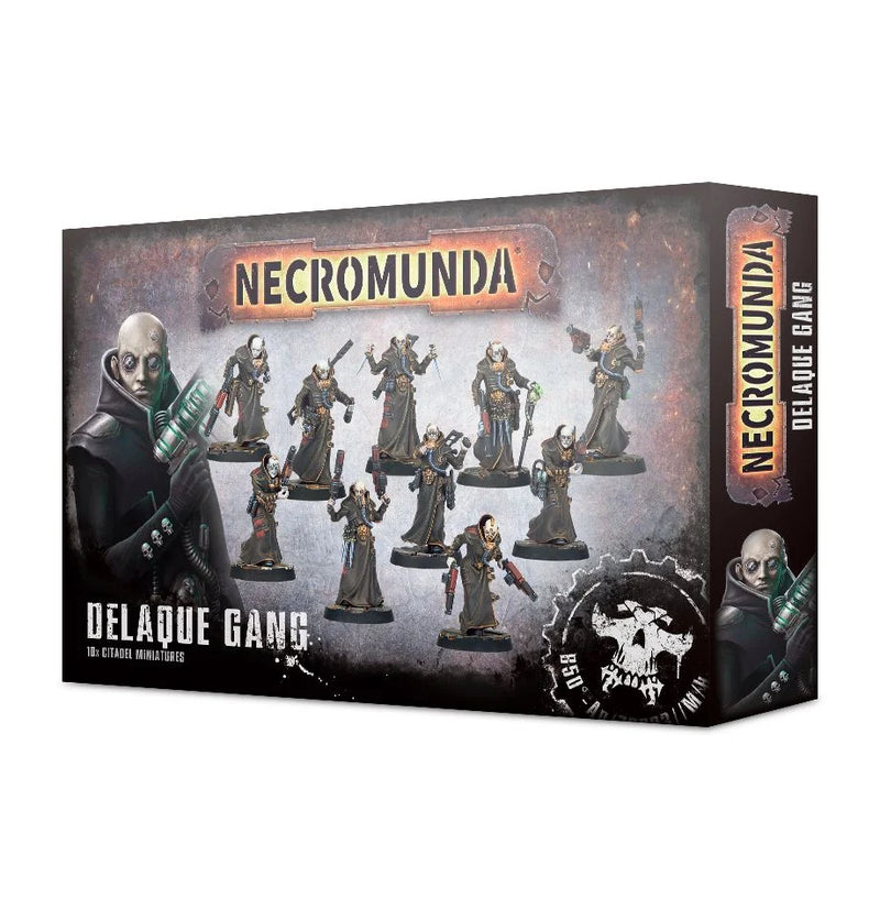 Box of Necromunda: Delaque Gang miniatures, showcasing painted sci-fi gangers in robes wielding assorted weapons. The packaging displays the text “Necromunda” and “Delaque Gang,” set against a dark, industrial-themed background that highlights these figures—ideal for customizing with Necromunda bases.