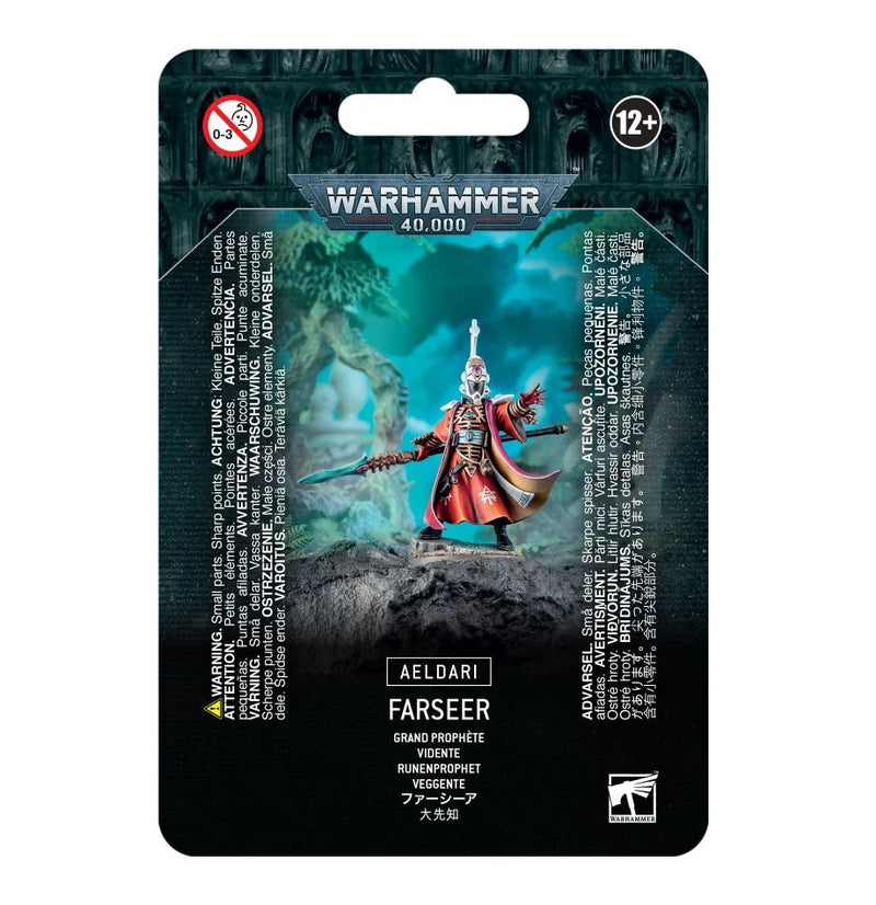 Packaging for Warhammer 40k: Aeldari Farseer plastic kit, painted figure in red robes with Singing Spear; age warnings, multilingual box details.