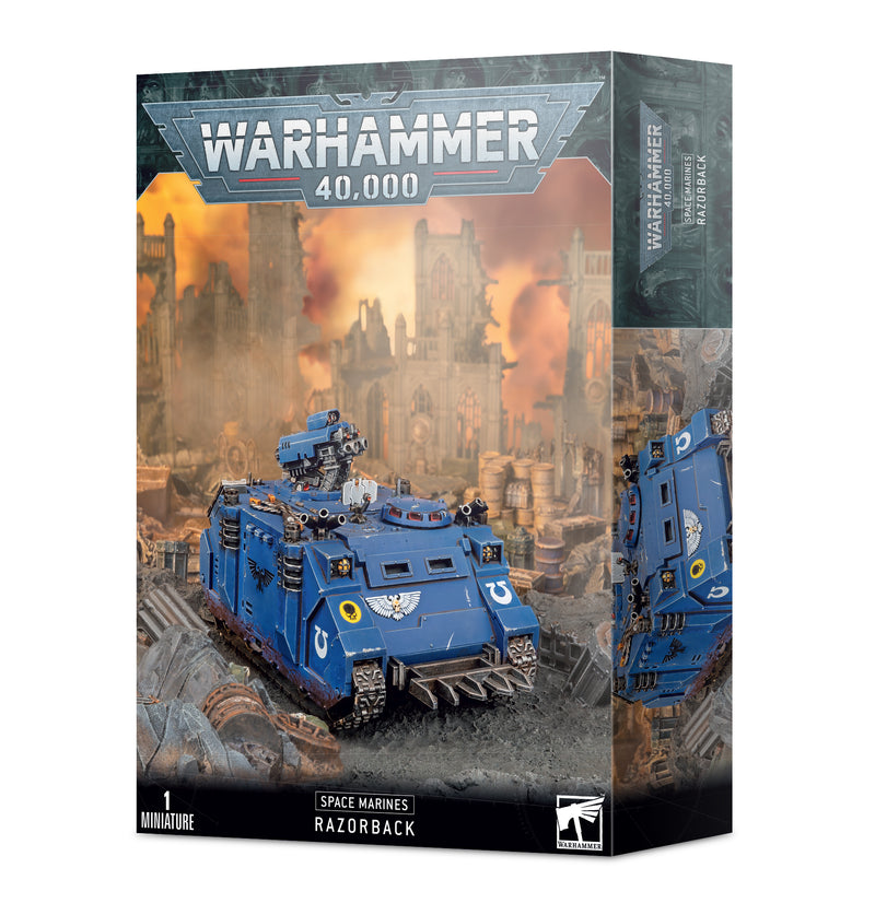 The Warhammer 40k: Space Marines - Razorback box depicts a blue Ultramarines armored vehicle with weapons, set amid a ruined city battlefield.