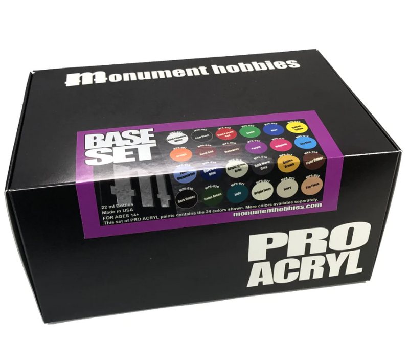 The Monument Hobbies Pro Acryl Paint: Base Set – 24 Colors comes in a black box labeled PRO ACRYL, with high-density pigment paints and a color chart shown on the front.