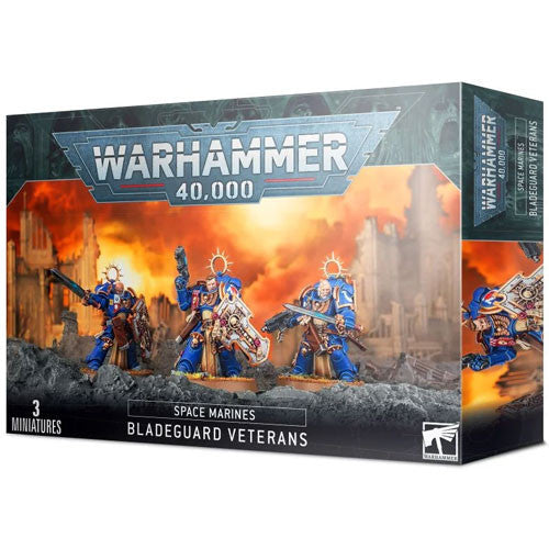Box of Warhammer 40k: Space Marines - Bladeguard Veterans by Games Workshop, featuring three blue-armored miniatures wielding swords and shields set against a dramatic war-torn backdrop.