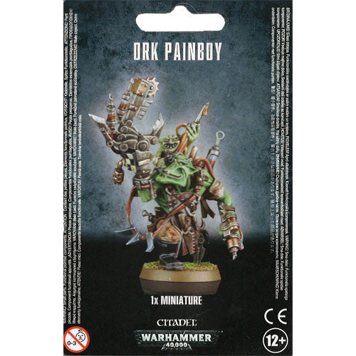 Packaging for Warhammer 40k: Ork Painboy showcases a detailed green orc-like figure with tools, weapons, branding, and age labels.