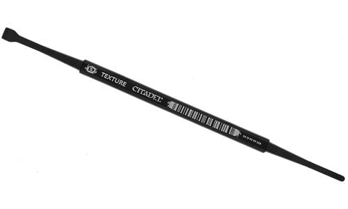 The Citadel Medium Texture Spreader is a black tool with a flat spatula on one end and a pointed tip on the other, ideal for applying texture paint to miniature bases.