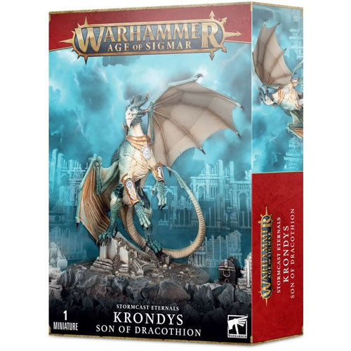 The box art for Warhammer Age of Sigmar: Stormcast Eternals - Krondys, Son of Dracothion features a striking unpainted miniature of Krondys, a majestic blue dragon with expansive wings, poised atop ancient ruins. This impressive model from Games Workshop is prominently displayed on the packaging.