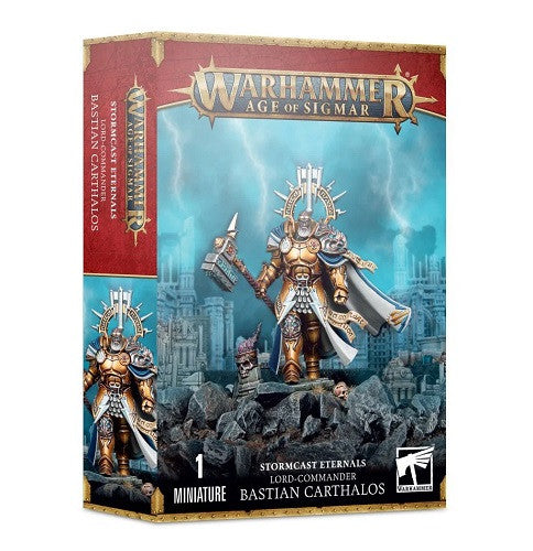 Box of Warhammer Age of Sigmar: Stormcast Eternals - Lord Commander Bastian Carthalos, featuring dynamic artwork of the gold-armored Lord-Commander Bastian Carthalos wielding a hammer and shield amid ancient ruins.